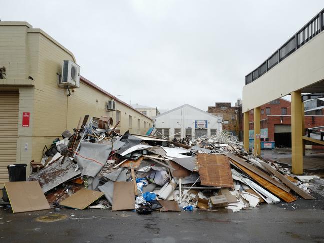 LISMORE, AUSTRALIA - MARCH 28: Debris sits piled up outside businesses affected by the recent floods in the main town on March 28, 2022 in Lismore, Australia. Residents in northern NSW are bracing for more flooding as heavy rainfall continues across the area. The Bureau of Meteorology has issued a severe weather warning the NSW northern rivers with 180 millimetres of rain forecast over the next two days. (Photo by James D. Morgan/Getty Images)