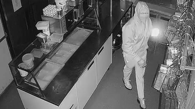 A suspect in the kitchen of Table 1 Espresso at Warners Bay after entry was gained about 3.55am on March 15. 2021. Cash and chocolates were stolen. Picture: supplied