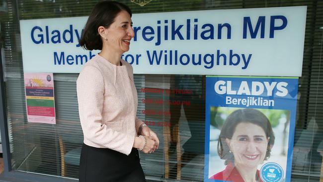 Gladys Berejiklian walks from her constituency office to speak to the waiting media in Naremburn. Picture: AAP Image/David Moir