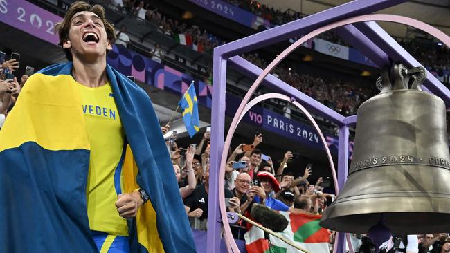 Sweden's Armand Duplantis celebrates winning the men's pole vault final and setting the new world record of 6.25m during the athletics event at the Paris 2024 Olympic Games at Stade de France in Saint-Denis, north of Paris, on August 5, 2024. (Photo by Ben STANSALL / AFP)