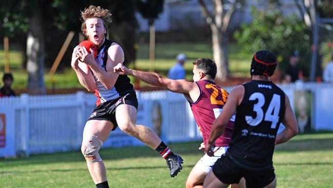 Morningside player Nathan Colenso takes a mark Picture, John Gass