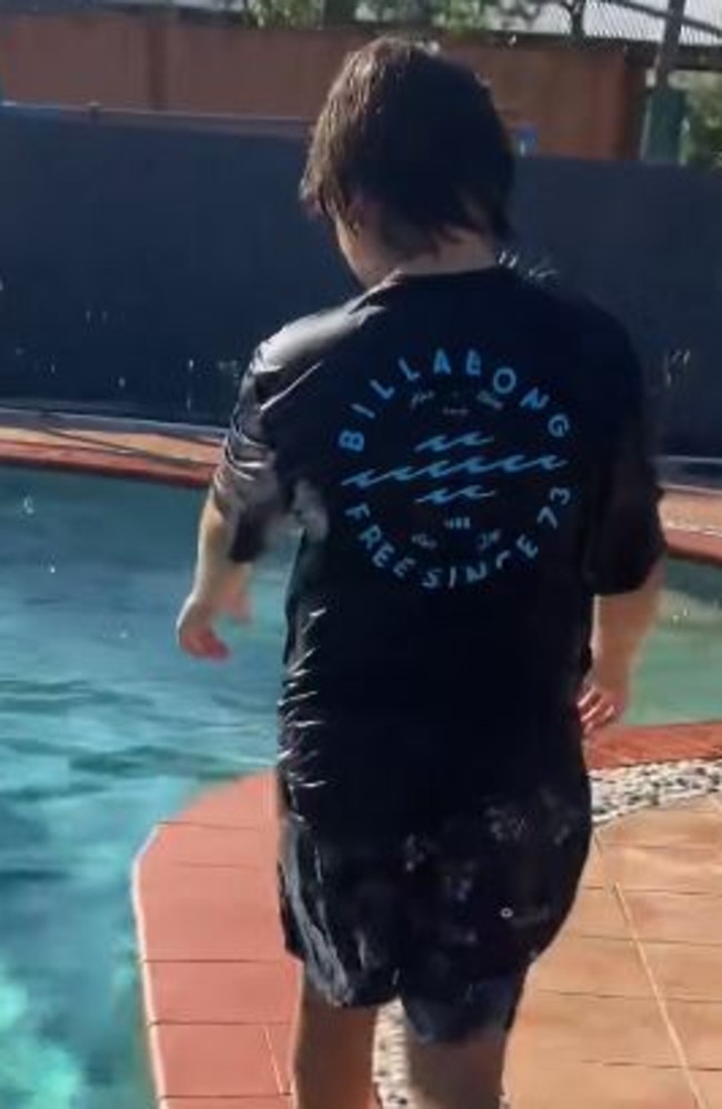 A family finds a croc in the family swimming pool after returning to house after FNQ weather event.