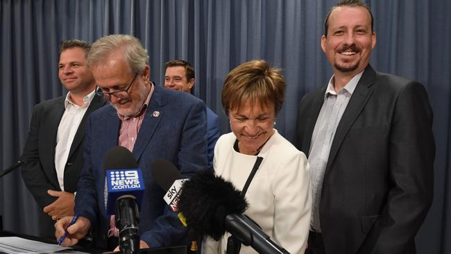 Shooters, Fishers and Farmers Party leader Robert Borsak speaks to the media alongside party membersPhil Donato, Roy Butler, Helen Dalton and Mark Banasiak in March 2019.