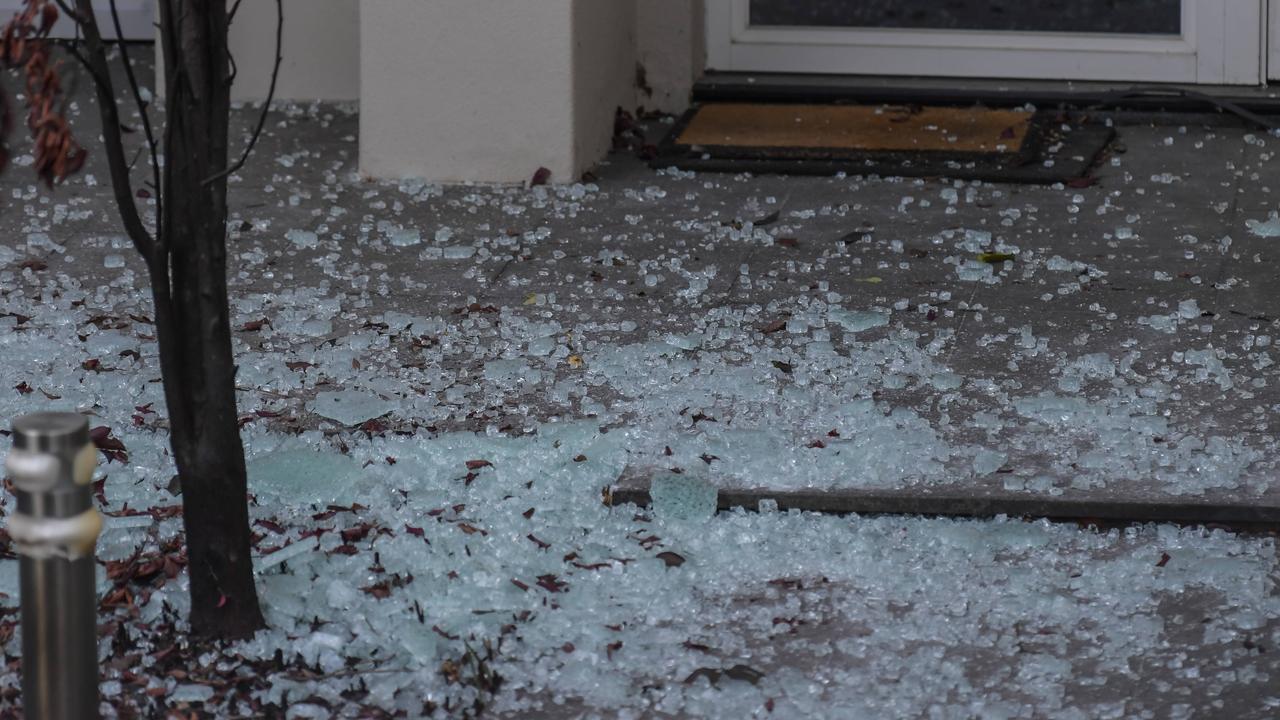 Shattered glass from the balcony litters the ground. Picture: RoyVPhotography