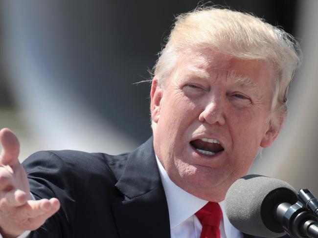 MILWAUKEE, WI - JUNE 13: U.S. President Donald Trump speaks about healthcare after arriving at General Mitchell International Airport on June 13, 2017 in Milwaukee, Wisconsin. After the brief remarks Trump greeted guests on the tarmac before departing the airport for a tour and roundtable discussion at Waukesha County Technical College. Trump is also scheduled to attend a fundraiser with Wisconsin Governor Scott Walker while in Milwaukee.   Scott Olson/Getty Images/AFP == FOR NEWSPAPERS, INTERNET, TELCOS & TELEVISION USE ONLY ==