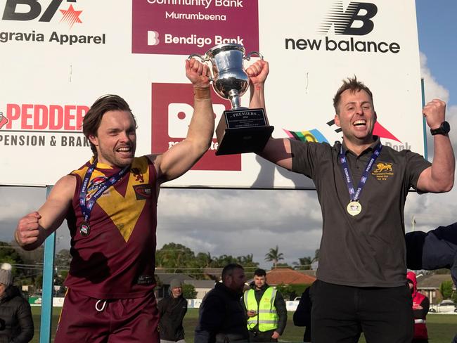 Jordan Pollard (L) and coach Michael Kinsella lift the 2024 cup. Picture: Valeriu Campan