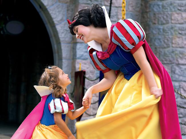 Snow White with children at Disneyland in California.