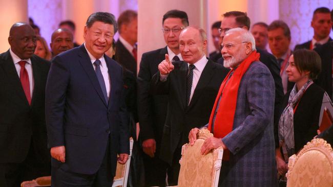 Chinese President Xi Jinping, Russian President Vladimir Putin and Indian Prime Minister Narendra Modi attend a concert prior to an informal dinner on the sidelines of the BRICS summit in Kazan. Picture: AFP