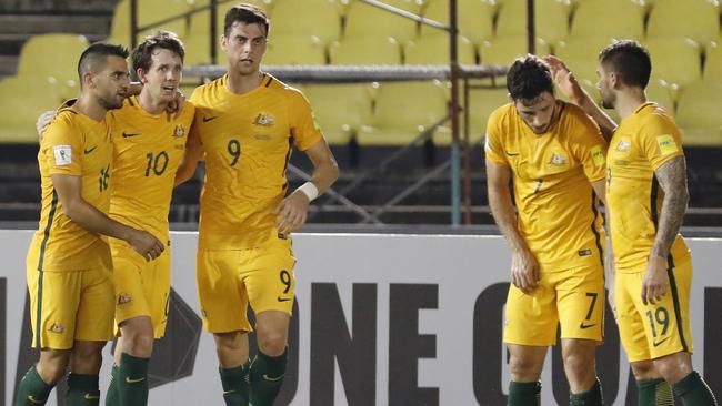 Australia's Robbie Kruse, second from left, celebrate with teammates.