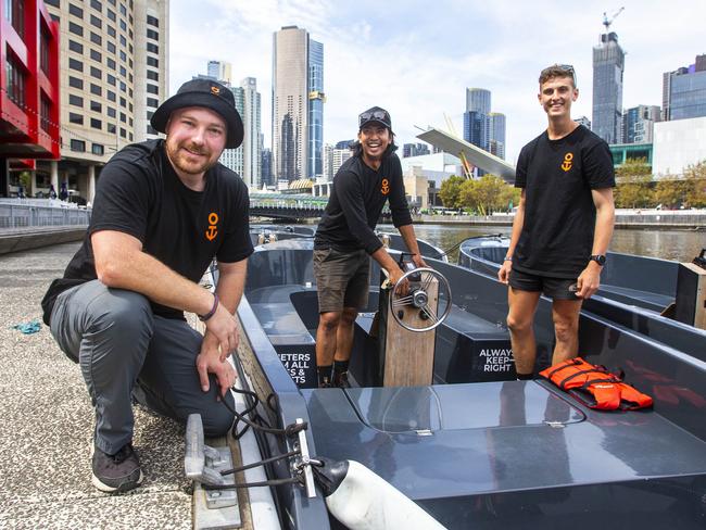 18/03/2021 On a Boat manager Shaun Ford (left) with employees Harry Gibbs (right) and Adam Moechyi (centre) on the Yarra River in Melbourne. Aaron Francis/The Australian