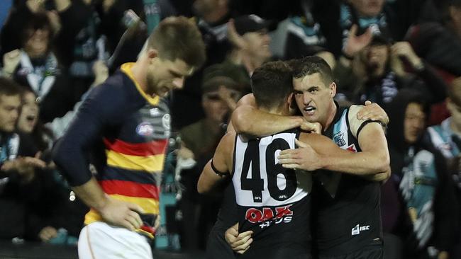 Sam Gray and Tom Rockliff celebrate a goal in Showdown 44. Picture Sarah Reed