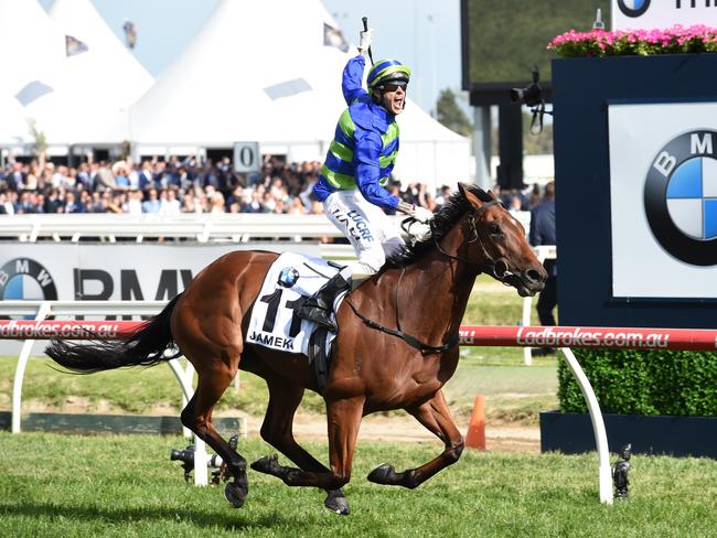 Nick Hall celebrates as Jameka crosses the line to effortlessly win the Caulfield Cup. Picture: Getty Images