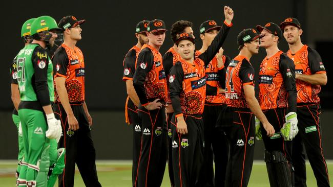 Ben Dunk (left) and Perth players wait for the umpire’s decision. Picture: AAP