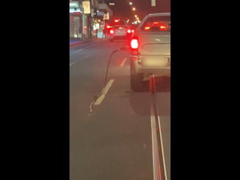 Ute speeds off with petrol pump still attached to car