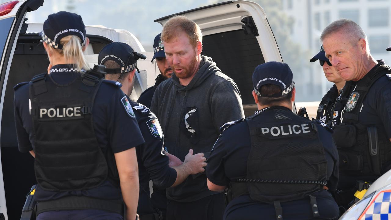 An Extinction Rebellion protestor is arrested after abseiling off William Jolly Bridge. Picture: Darren England/AAP