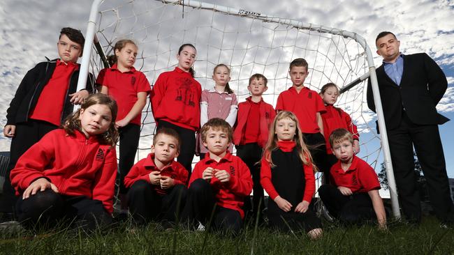 St Kilda Primary school president Ben Pratt with some of the students on their oval they don’t want to lose. Picture: Mark Wilson