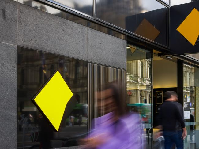 MELBOURNE, AUSTRALIA - MAY 03: People are seen walking past a Commonwealth Bank of Australia branch on May 03, 2022 in Melbourne, Australia. The Reserve Bank of Australia has today lifted the official interest rate to 0.35 per cent following a meeting today. The rise is the first interest rate increase since November 2010. (Photo by Asanka Ratnayake/Getty Images)