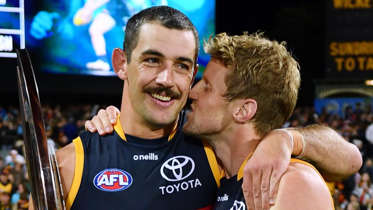 Rory Sloane of the Crows kisses Taylor Walker of the Crows holding the Showdown Shield after the round three AFL match between Port Adelaide Power and Adelaide Crows at Adelaide Oval, on April 01, 2023, in Adelaide, Australia. (Photo by Mark Brake/Getty Images)