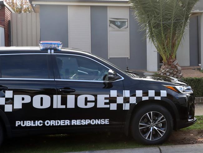 Police arrested 13 people and executed a series of warrants in the north west suburbs of Melbourne this morning as part of a major investigation into drug trafficking. Detectives from the Drug Task Force and other Crime Command units executed the warrants with the assistance of the Special Operations Group from 3am.  Police inside the house at Sydenham.  Picture: Alex Coppel