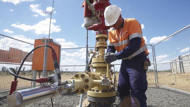 An Arrow Energy worker at its Tipton gas project 30km west of Dalby.
