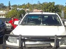 A man brandishing a spanner gets out of the rear vehicle and attacks the woman's window with the make-shift weapon. Picture: Facebook/Dash Cam Owners Australia