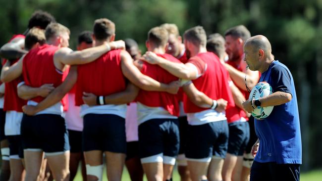 Eddie Jones, the England head coach, walks past his team during the England training session