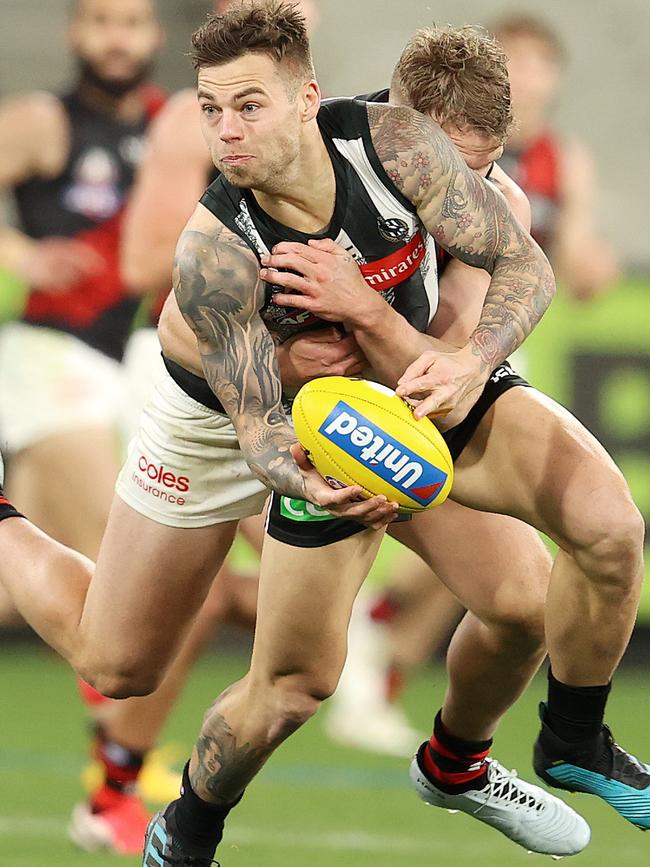 Jake Stringer applies a big tackle on Jamie Elliott.