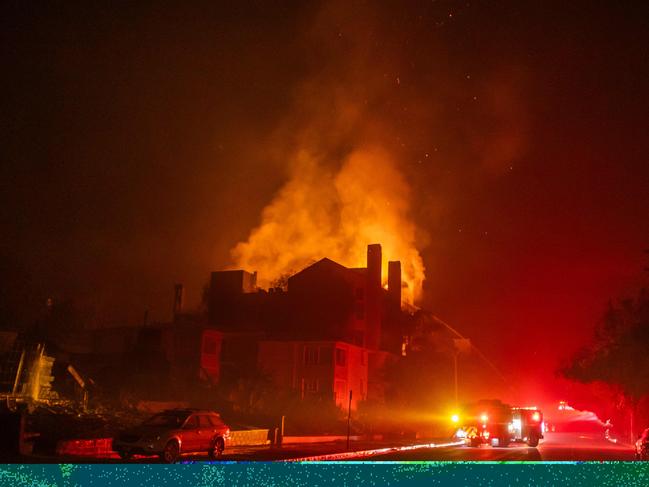 Flames from the Palisades Fire burn a residential building on Sunset Boulevard. Picture: Apu Gomes/Getty Images/AFP