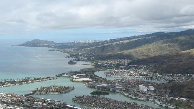 Hugging the coast below the crater is the town of Hawaii Kai. In the distance is the famous Diamond Head and Waikiki. Photo: John Affleck