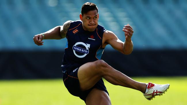 Israel Folau kicks during the Waratahs Super Rugby Captain's Run ahead of their match against the Brumbies at Allianz Stadium, Sydney. Pic Brett Costello