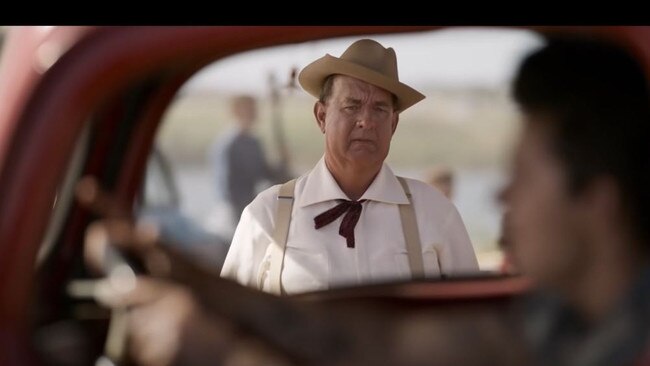 Tom Hanks playing Colonel Parker in the movie Elvis.