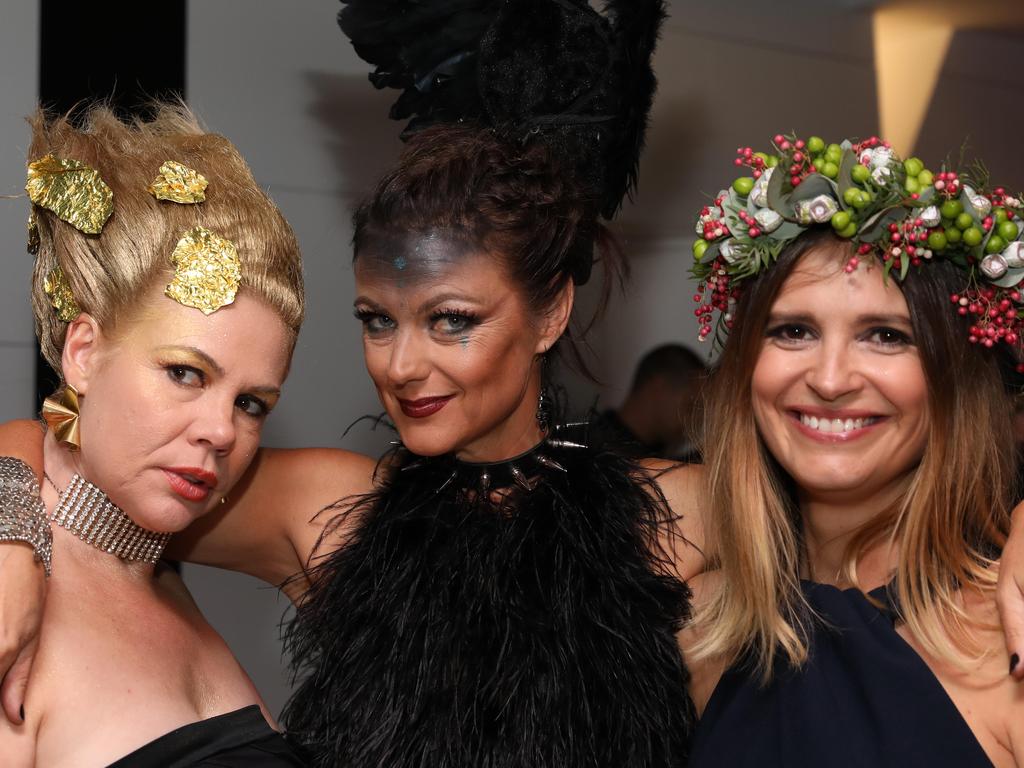 Emma Bayly, Fiona Pannell and Georgie Watts at The Cube Surrealist Ball at d’Arenberg in McLaren Vale. Picture: AAP/Russell Millard