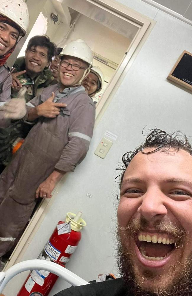 A clearly overjoyed Xavier Doerr with his delighted rescuers aboard container ship Theodore JR. Picture: The Little Aussie Lap / Facebook