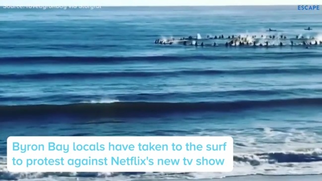 Byron Bay locals paddle out in protest of new Netflix show