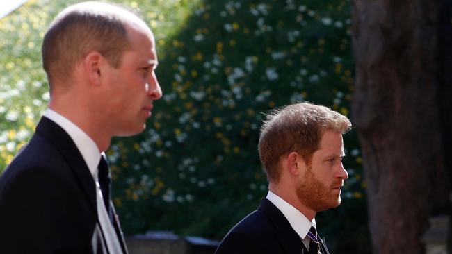 Prince William, left, and Prince Harry follow the coffin. Picture: AFP