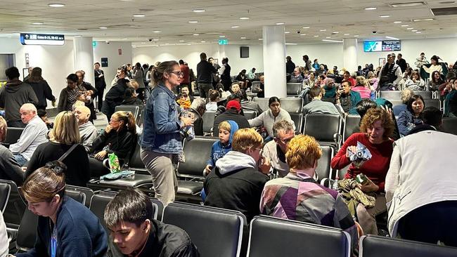 Malaysian Airlines passengers were forced to disembark their plane after it returned to Sydney Airport. Picture: Supplied.