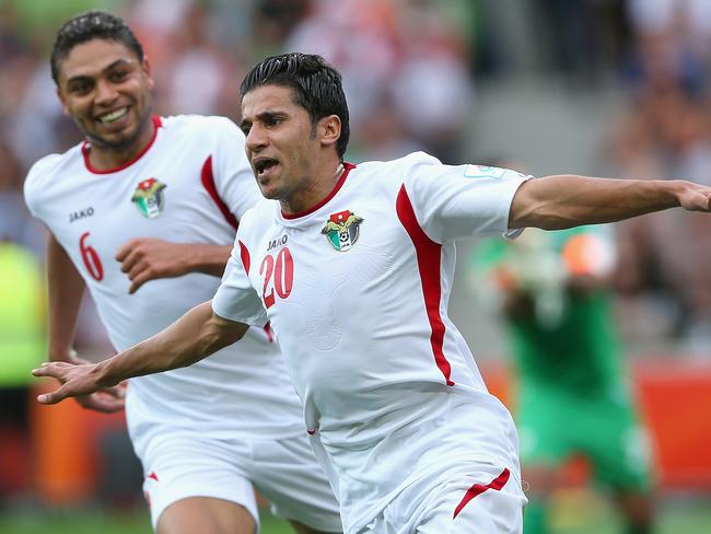 MELBOURNE, AUSTRALIA - JANUARY 16: Hamza Al Dardour of Jordan celebrates scoring a goal during the 2015 Asian Cup match between Palestine and Jordan at AAMI Park on January 16, 2015 in Melbourne, Australia. (Photo by Quinn Rooney/Getty Images)