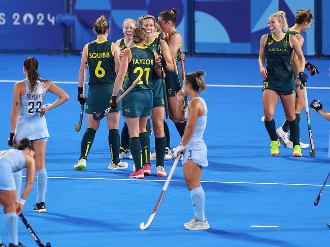 PARIS, FRANCE - AUGUST 01: Mariah Williams of Team Australia (obscured) celebrates scoring her team's third goal during the Women's Pool B match between Argentina and Australia on day six of the Olympic Games Paris 2024 at Stade Yves Du Manoir on August 01, 2024 in Paris, France. (Photo by Alex Pantling/Getty Images)