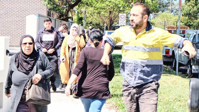 Worried parents rush to Banksia Rd Public School, Greenacre, following reports a car has crashed into a classroom. Picture: Eliza Barr A NSW Department of Education spokesman said the school would be open tomorrow “for anyone who wishes to attend”.