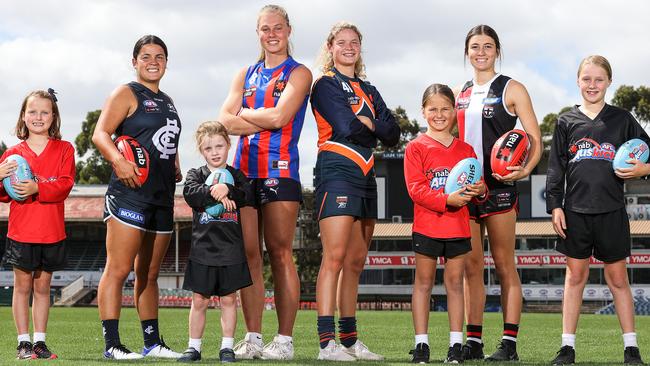 (From left) Maddie Prespakis, Charlie Rowbottom, Georgie Prespakis and Georgia Patrikios launch the NAB League Girls season with some Auskick future AFLW hopefuls.