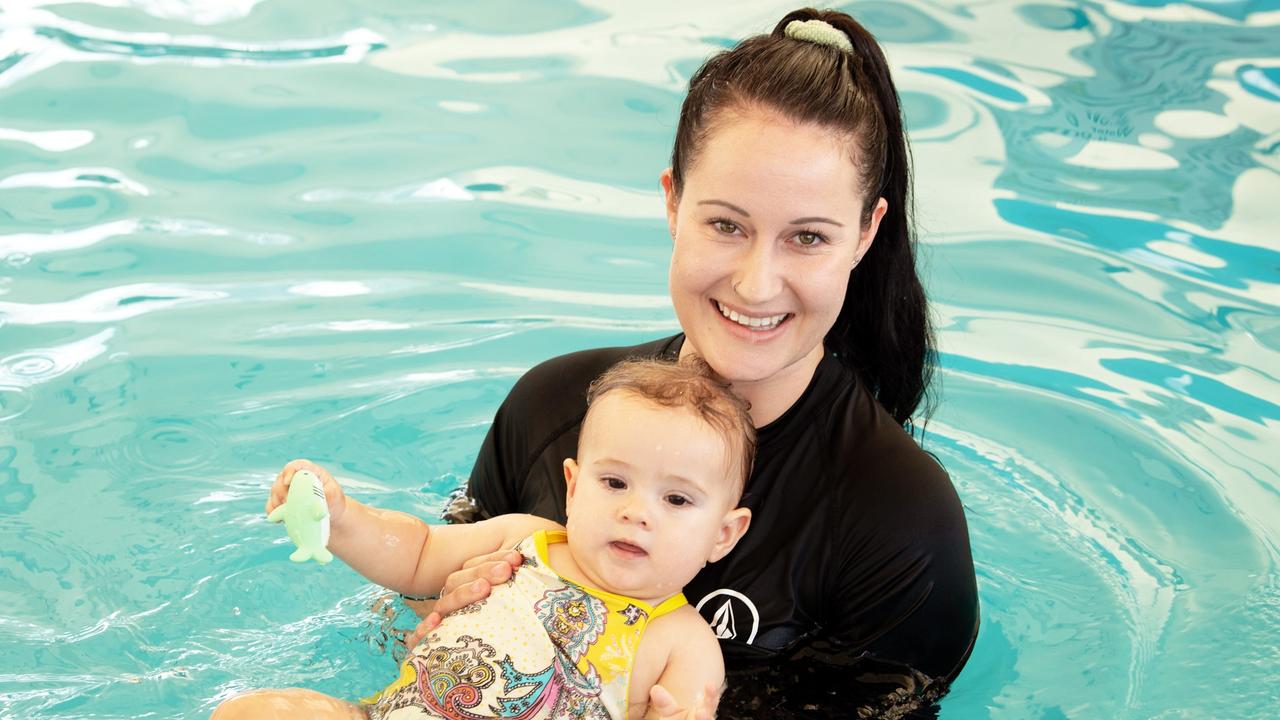 Toddlers receiving free swimming lessons from Bluefit Swimming at the Cotton Tree pool. Pictured, Hannah Searle with 11 month old Melia Head. Photo: Patrick Woods.