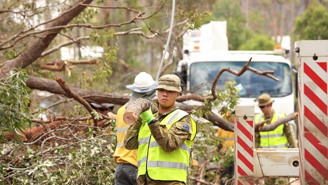 ADF help in the clean up at Kriedeman Road in Wangawallan after ferocious storms dame the Gold Coast area. Pics Adam Head