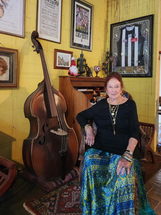 Ms Lawrie loves her cat, the double bass and the mighty magpies. Picture: Darcy Fitzgerald