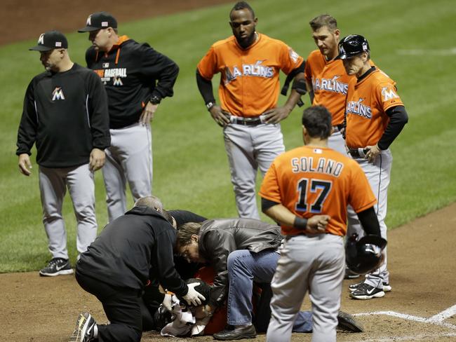 Doctors tend to Stanton on the ground.