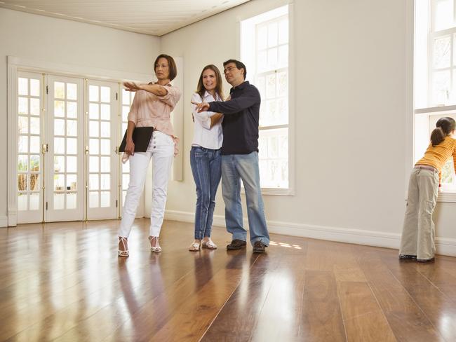 Realtor with a family in an empty room. Picture: Thinkstock