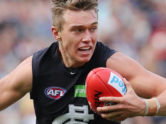 AFL Round 7. Collingwood v Carlton at the MCG. Patrick Cripps brushes past Adam Oxley . Pic: Michael Klein