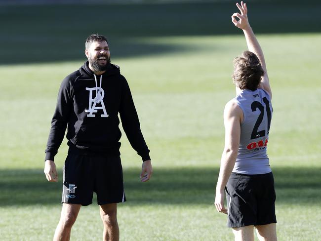 21/06/18 - AFL - Port Adelaide training at Adelaide Oval. Paddy Ryder has a laugh with Jared Polec after winning a "closest to the pin" competition Picture SARAH REED