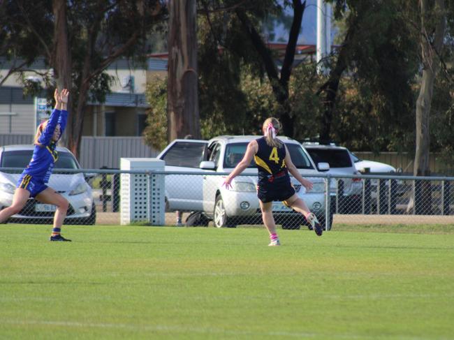 SFLW Community League - Sorell Ava Rawson gets a kick away during the match against St Virgils during the annual Pink Sock-Carolyn Birch Memorial Match. Picture: Jake Garland
