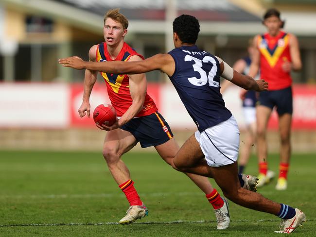 ADELAIDE, AUSTRALIA – June 30: Sid Draper of South Australia and Adrian Cole of Victoria Metro during the 2024 Marsh AFL Championships U18 Boys match between South Australia and Victoria Metro at Alberton Oval on June 30, 2024 in Adelaide, Australia. (Photo by Sarah Reed/AFL Photos via Getty Images)