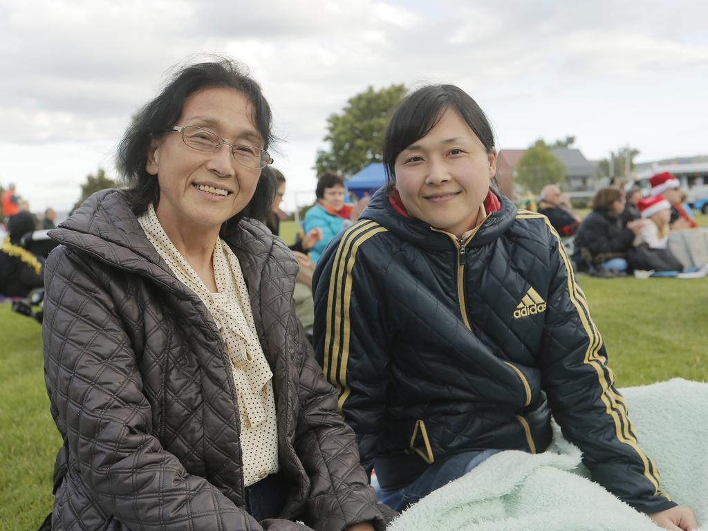 SOCIALS Chi Sa Ko Takahashi of Japan, left, and her daugher Yumi Takahashi of Sandy Bay at the Carols on the Hill, Guilford Young College, West Hobart. Picture: MATHEW FARRELL